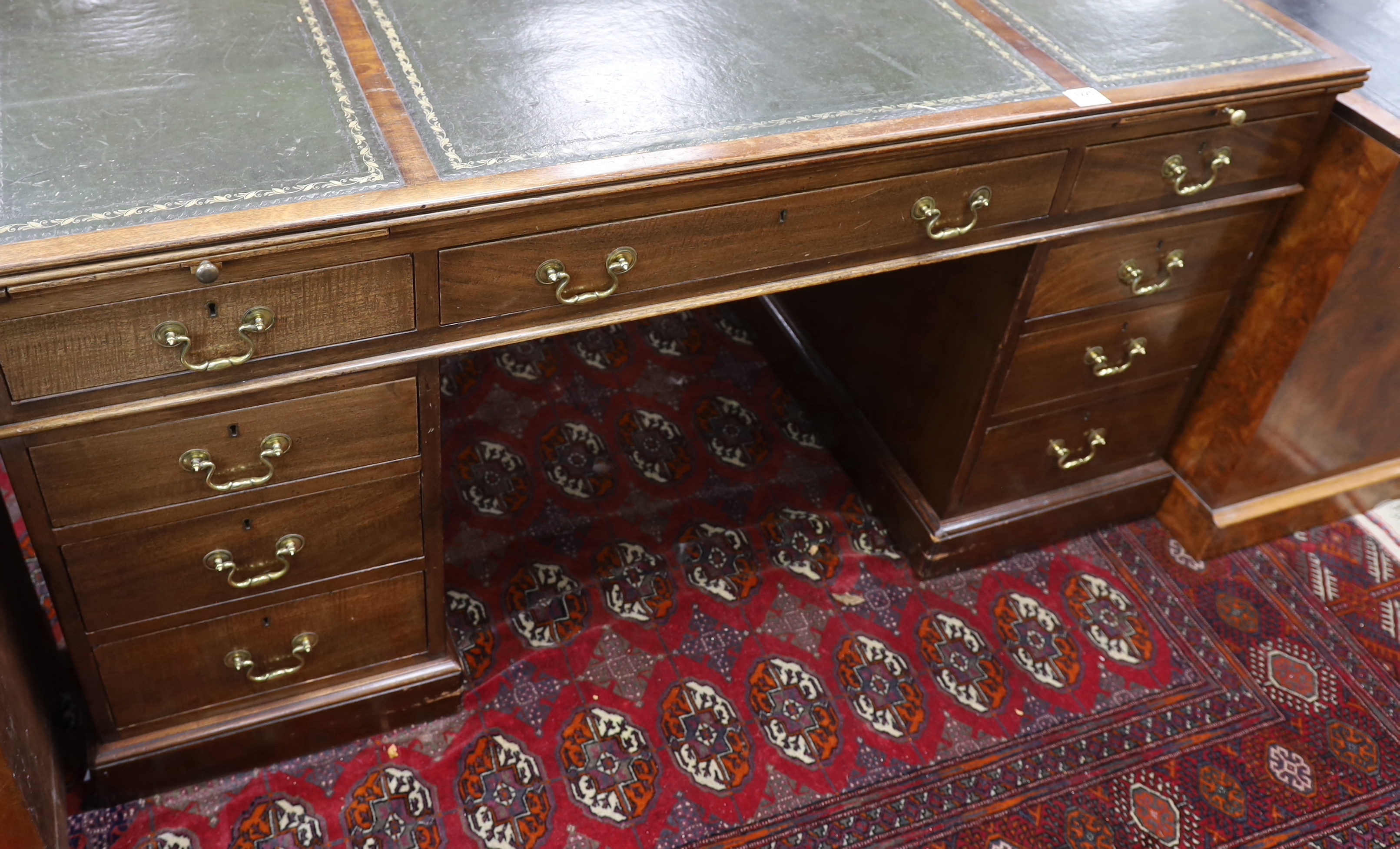 An early 20th century George III style mahogany pedestal partner's desk, width 152cm, depth 98cm, height 78cm